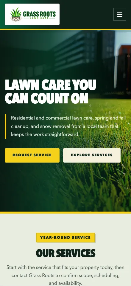 Grass Roots Lawncare’s website on a phone